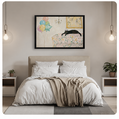 Black-framed wall art print of a party cat with colorful balloons hung above a neutral bedroom bed, showcasing a cozy and whimsical interior styling