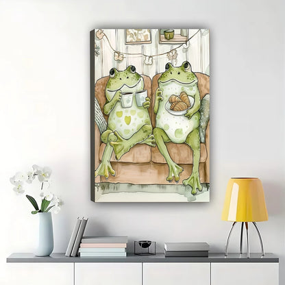 Cozy Frogs on Couch Wall Art – Whimsical Frog Couple Canvas Print with Natural Wood Frame | W2078