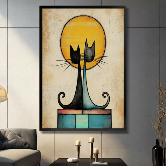 Abstract black and teal cat duo with golden moon framed canvas wall art displayed in modern living room with dark accent wall