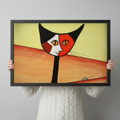 Person holding abstract cubist cat and mouse framed art print showing actual size reference with bold red black and yellow design
