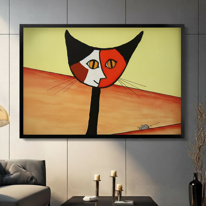 Abstract cubist cat and mouse framed wall art print displayed in a modern living room with gray tile wall and dark sofa