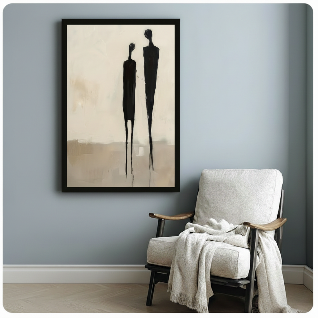 Framed minimalist couple silhouette wall art beside wooden accent chair on blue-grey wall - abstract figurative canvas print for reading nook or bedroom