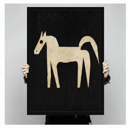 Person holding large abstract horse canvas art print showing scale — black background with cream horse silhouette