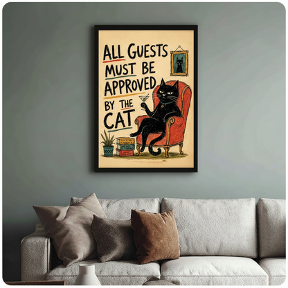 Framed funny black cat quote poster above linen sofa on sage green wall - retro all guests must be approved by the cat canvas wall art with bold typography and vintage illustration for stylish living room decor