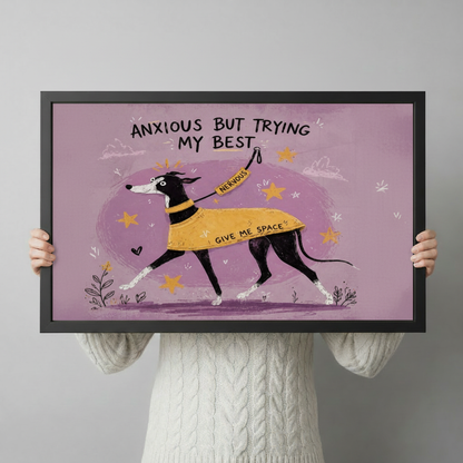 Anxious But Trying My Best greyhound dog wall art in black frame held up by two hands against a light gray background showing print size and framing detail