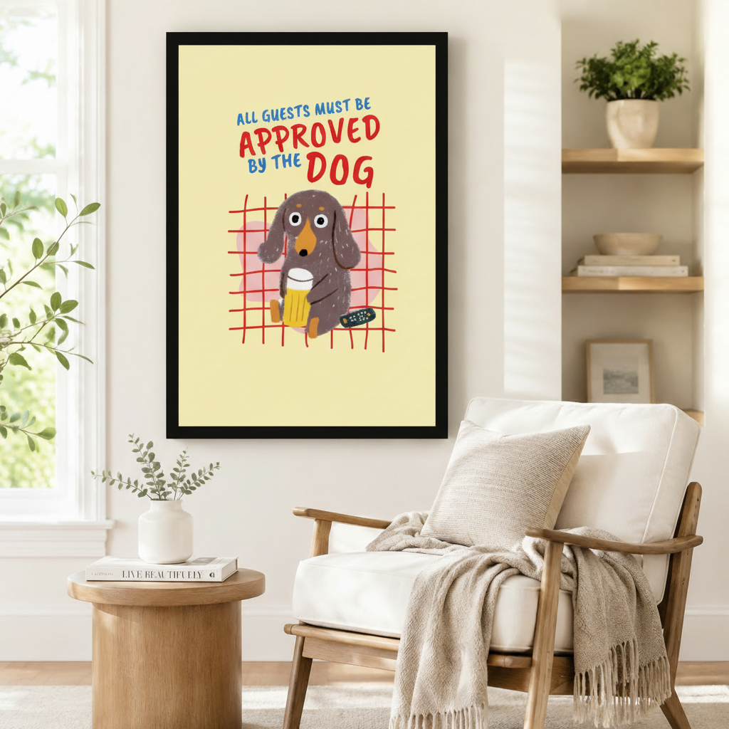 Whimsical dachshund art print in black frame beside a linen armchair in a Scandinavian-style reading nook – dog lover home decor