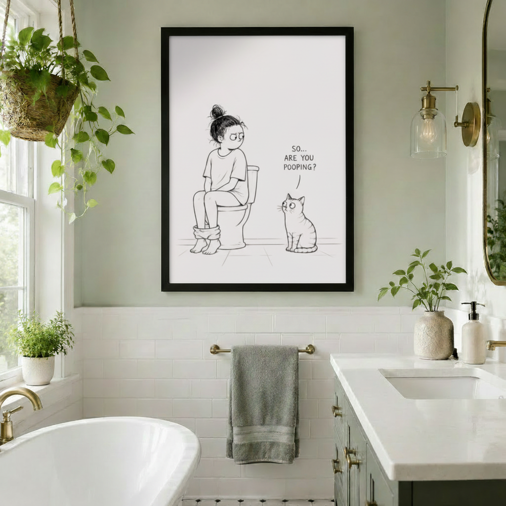 Hands holding a large framed funny cat and toilet humor canvas print, showing size reference and print quality for bathroom wall art gift