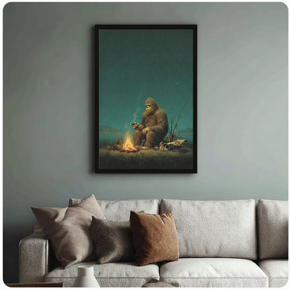 Framed retro realist oil painting Bigfoot sitting by campfire smoking cigar with fishing rods under starry night sky canvas print above cream sofa on sage blue-grey wall - humorous Sasquatch camping wall art with warm amber firelight and deep teal night sky for stylish living room decor