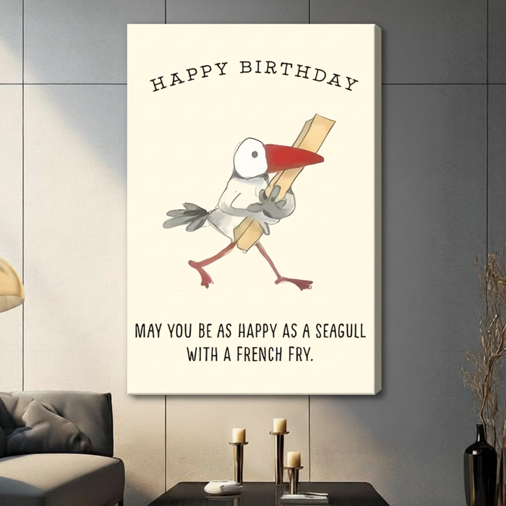 Gallery-wrapped stretched canvas of a chubby cartoon seagull holding a french fry with Happy Birthday and may you be as happy as a seagull with a french fry quote, funny illustrated bird print on off-white background, hung above a dark sideboard with candlesticks against a gray paneled wall