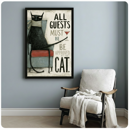 Framed vintage-style black cat poster beside armchair - All Guests Must Be Approved By The Cat - cat owner gift wall art