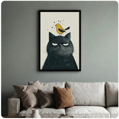 Framed black cat and yellow bird canvas art displayed above a light grey sofa in a modern American living room, whimsical pet illustration print