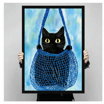 Person holding a large framed black cat in blue mesh bag art print, showing vivid brushstroke texture and bold blue rope detail against an aqua background