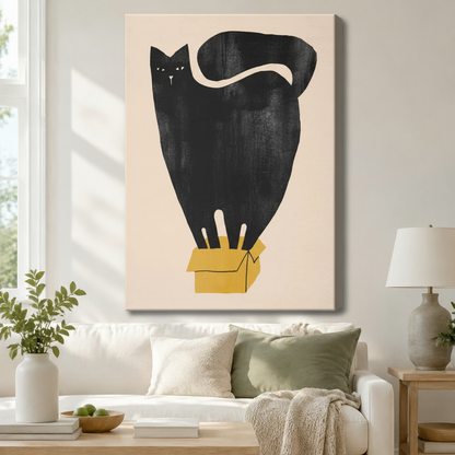 Stretched canvas oversized black cat in yellow box minimalist illustration wall art hung above a white sofa with sage green cushions in a modern living room