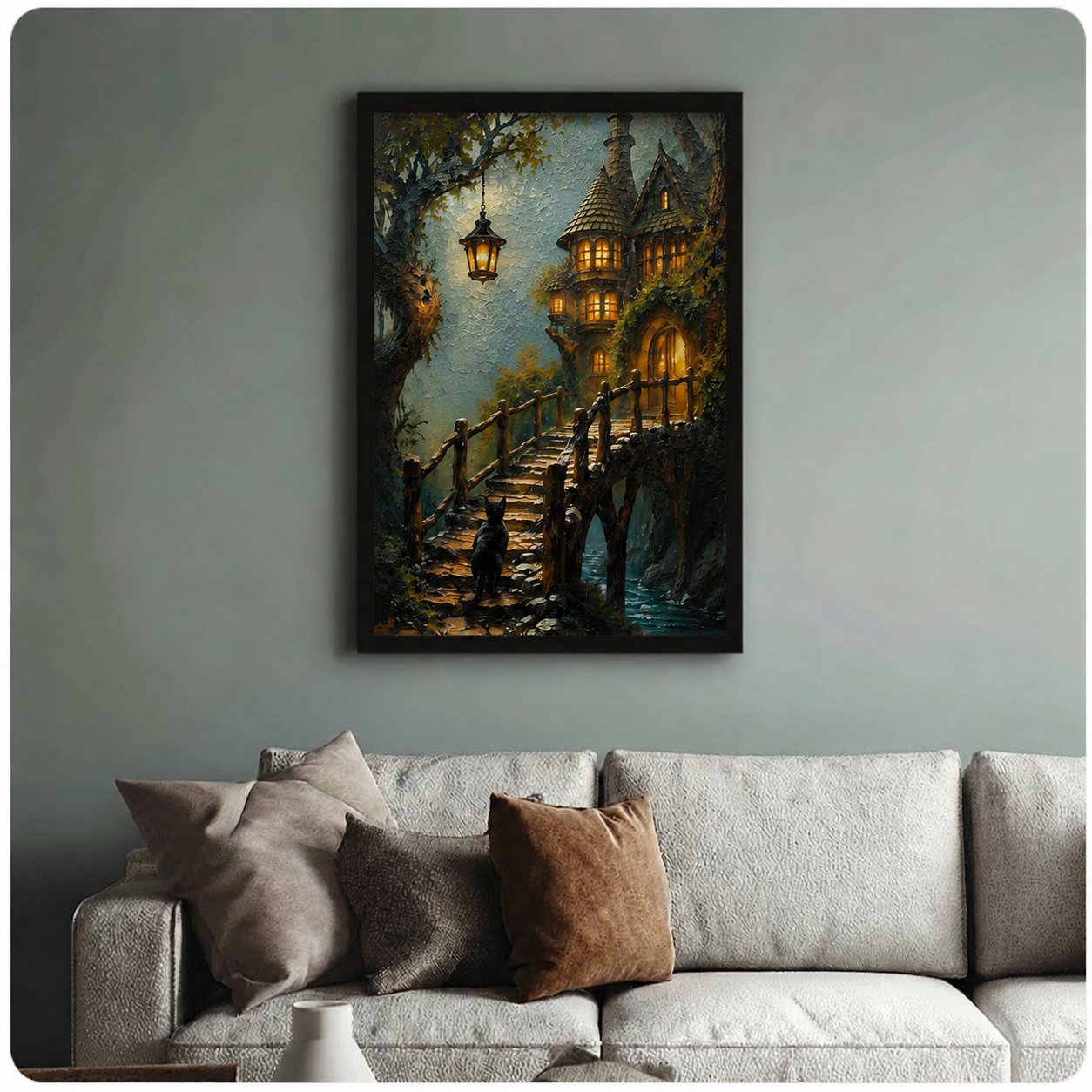 Black framed fantasy cat wall art print showing a black cat on a wooden bridge beneath a hanging lantern with a glowing fairytale treehouse, styled above a neutral linen sofa