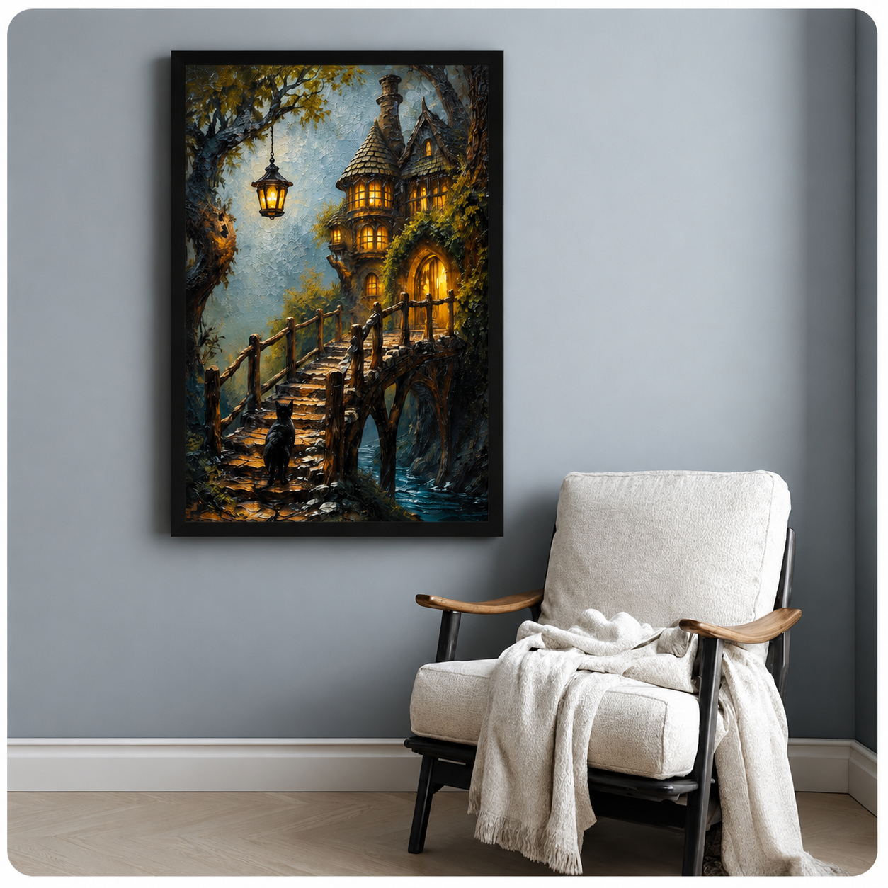 Enchanted forest framed art print of a black cat climbing stone steps toward a magical lit treehouse at dusk, hung on a blue-grey wall beside a linen armchair with a white throw