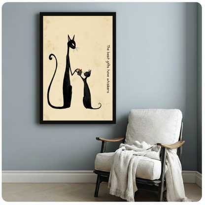 Black cat and kitten gift illustration in black frame beside linen accent chair – cat lover wall art