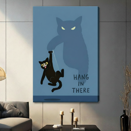Humorous black cat held up by looming shadow cat paw on steel blue background, "Hang In There" quote canvas wrap wall art in contemporary living room setting