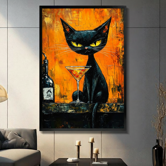 Expressionist palette knife oil painting of a black cat with sharp yellow-green eyes sitting on a dark bar ledge beside a tall martini glass of amber cocktail and a dark liquor bottle against a vivid orange gold and red impasto background bold cat bar art framed print in a living room with dark gray panel wall dark sofa and black vase