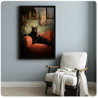 Framed black cat martini portrait canvas wall art displayed on blue-gray wall beside a white linen armchair vintage gothic oil-style animal art in living room setting