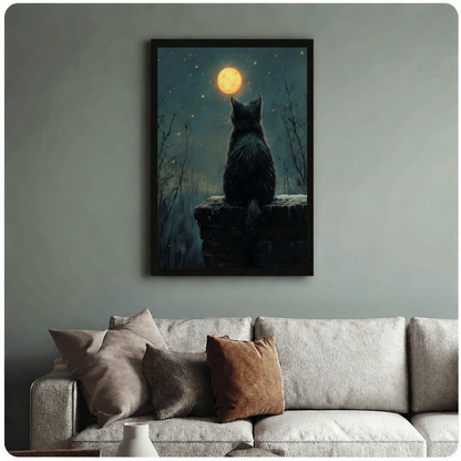 Black framed canvas art of a mysterious cat gazing at the moon at night, hung above a neutral sofa on a sage green wall