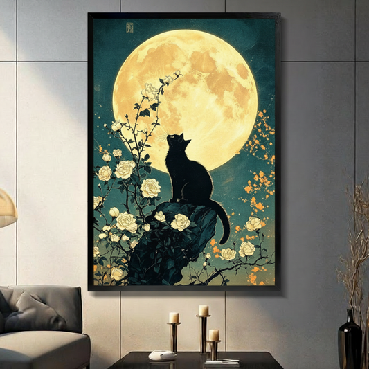 Japanese ukiyo-e style illustration of a black cat silhouette perched on a rock gazing up at a glowing full moon surrounded by white rose branches and golden orange blossoms on a teal night sky cat wall art framed print in living room with light gray panel wall and dark sofa