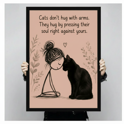 Hand-held black-framed poster print of black cat and girl illustration with inspirational cat soul hug quote
