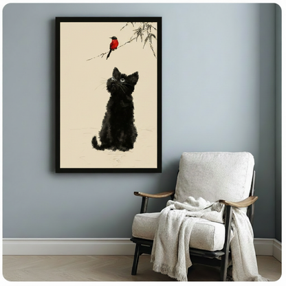 Chinese ink wash illustration of a round fluffy black kitten sitting and looking up at a small red bird on a bamboo twig against a warm cream background serene cat and bird wall art framed print beside a white linen armchair on a blue gray wall