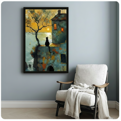 Framed black cat ocean sunset wall art canvas print hung on a light gray wall above a white armchair with a draped throw blanket