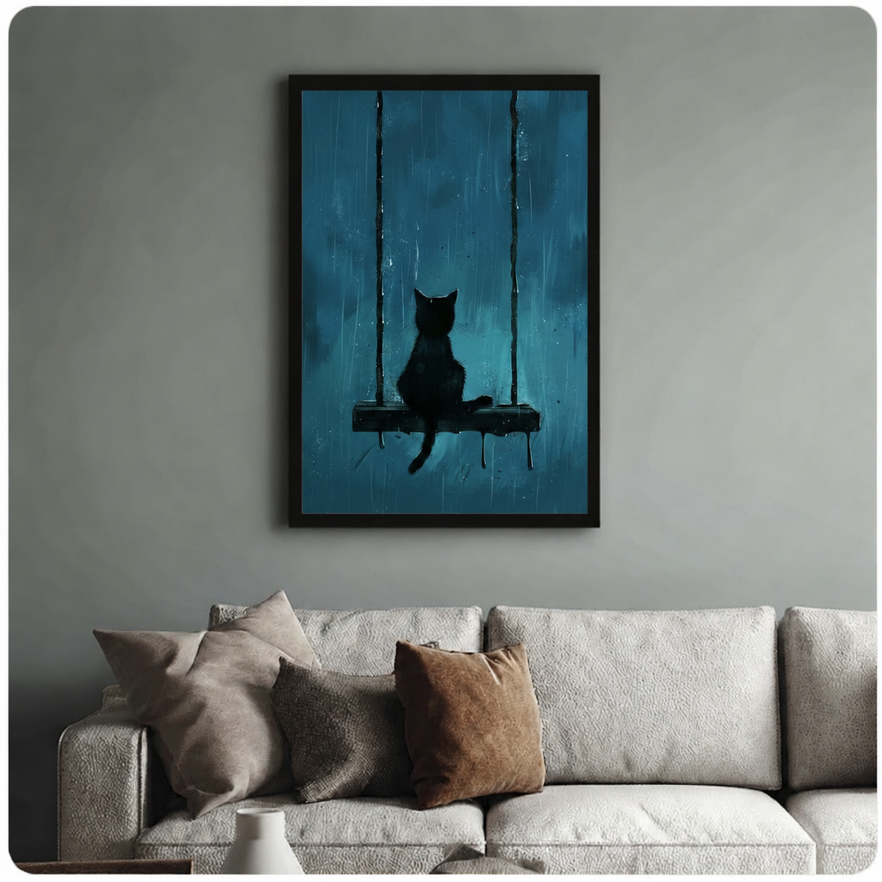 Framed black cat swing rain art print hanging above a neutral cream sofa — gothic moody wall decor