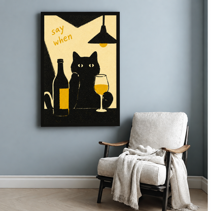 Black cat wine canvas wall art beside a white armchair, depicting a cat at a bar under a pendant light