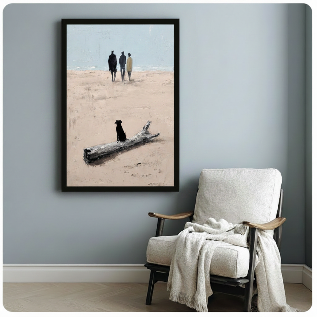Black dog beside driftwood on sandy beach with three distant figures framed impasto oil painting beside white linen wood armchair on blue grey wall – beige sand ocean coastal canvas art for reading corner