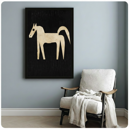 Bold abstract horse framed wall art beside a white linen armchair in a calm blue-grey reading nook
