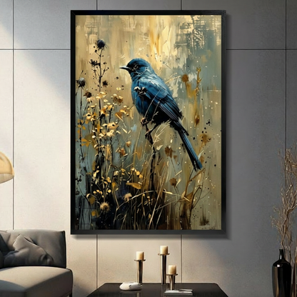 Black framed impressionist deep blue bird perched on a wild stem among golden wildflowers with black ink botanical branches and gold paint splashes on a warm teal and amber impasto abstract background canvas wall art displayed in a modern gray living room with dark sofa and metal candlesticks