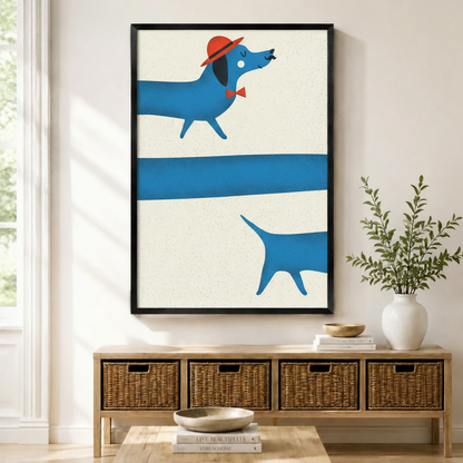 Framed canvas print of a whimsical blue dachshund wearing a red hat and bow tie in bold minimalist illustration style, displayed above a rattan storage console in a bright Scandinavian entryway
