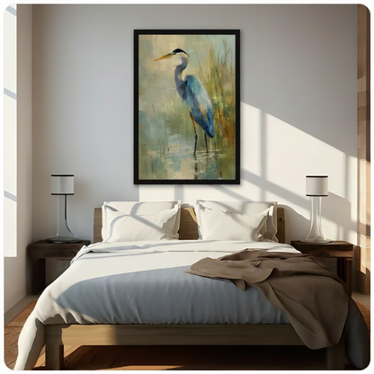 Framed great blue heron canvas wall art hung above a bed in a sunlit minimalist bedroom, nature-inspired oil painting in soft blue and gold palette