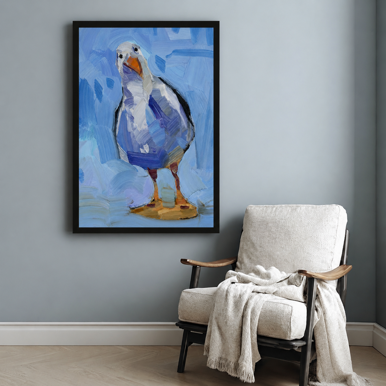 Blue seagull framed poster print hanging above accent chair in minimalist room, impressionist bird painting wall art
