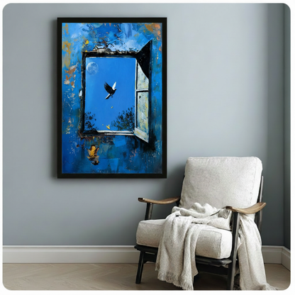 Black framed surrealist oil painting poster of a textured blue peeling wall with an open window, a black bird in flight, a moon in the sky, and a dreamy guitar figure, styled beside a white linen armchair on a blue-gray wall