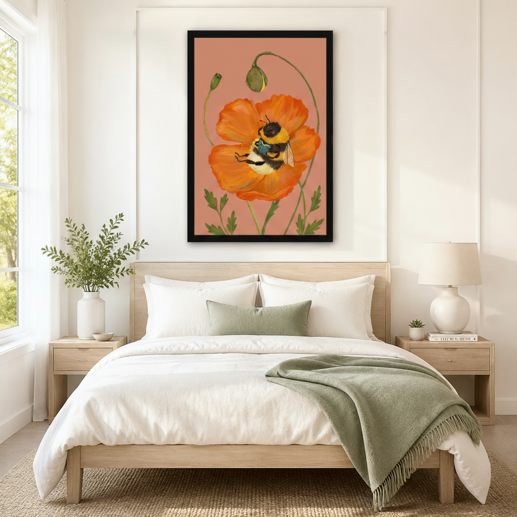 Oversized framed botanical wall art of a bumblebee resting in a blooming orange poppy on a warm blush background, displayed above a neutral linen bed in a serene Scandinavian bedroom