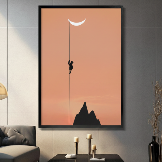 Framed minimalist wall art of a black cat silhouette climbing a rope toward a crescent moon, displayed in a dark modern living room with candlestick decor