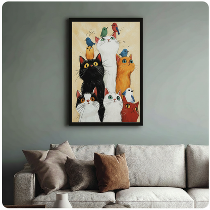 Black framed cute cats and birds wall art print on sage green wall above linen sofa in bright living room