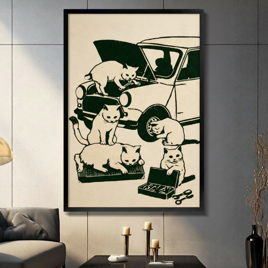 Black framed retro vintage woodblock print illustration of five white cats fixing a classic car one cat on the hood with a wrench one crouching by the headlight one inspecting the tire one lounging on a parts tray and one smiling over an open toolbox with wrenches on a warm cream background funny cat mechanic canvas wall art displayed in a modern gray living room with dark sofa and candlesticks
