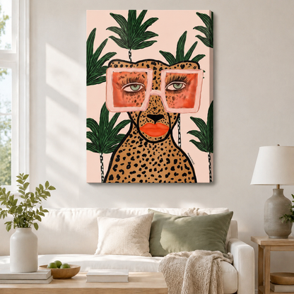Framed cheetah with pink sunglasses and tropical palm leaves canvas wall art displayed above a white sofa in a bright modern living room
