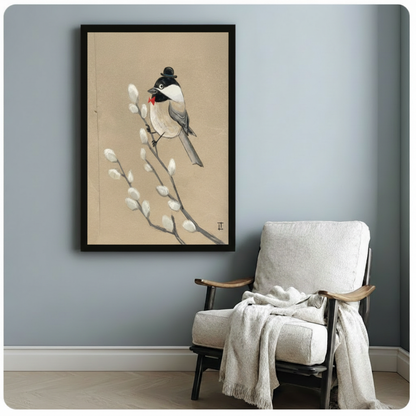 Framed chickadee with bowler hat and red bow tie art print hanging on soft blue-grey wall beside a cozy linen armchair