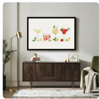 Framed summer cocktail wall art print displayed above a dark wood sideboard in a bright living room, featuring four illustrated drinks with lime and strawberry