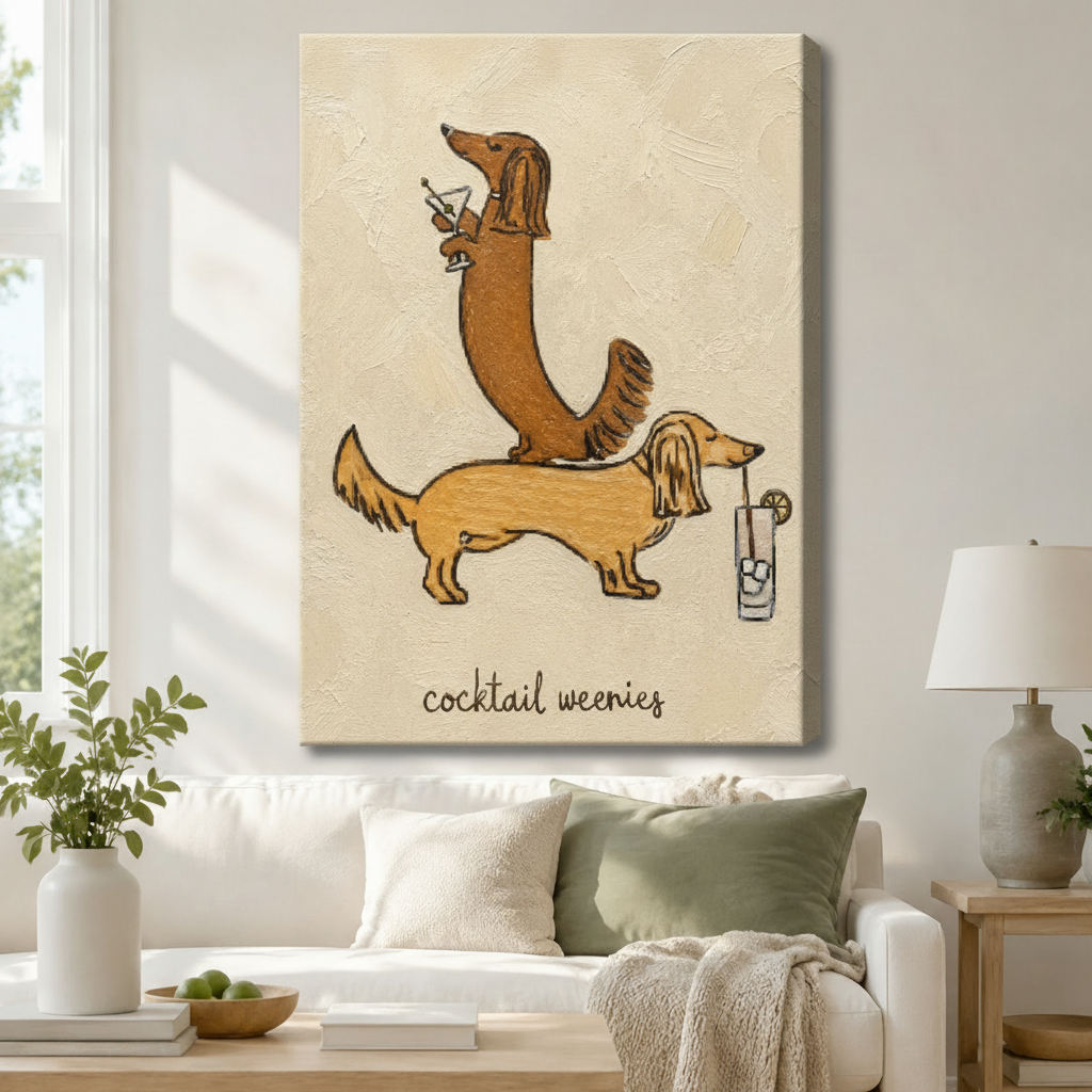 Gallery wrap canvas of two playful dachshunds balancing cocktails with hand-lettered "cocktail weenies" text in warm cream and golden tones, hung above a white linen sofa adding witty dog lover humor to a neutral boho living room