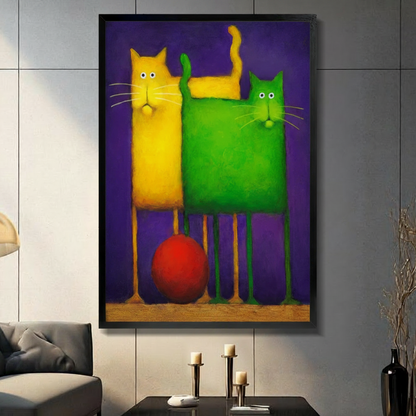 Black framed bold colorful yellow and green cat duo canvas art with a bright red ball between their long thin legs on a deep purple background, displayed on a gray tile wall above a console table with pillar candlesticks beside a charcoal sofa