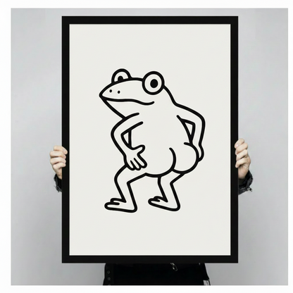 Confident frog framed canvas wall art held by hands — minimalist black line art on white background showing print size and quality
