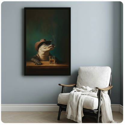 Black framed portrait print of a cowboy alligator holding a cigar beside a whiskey glass, hung above an armchair