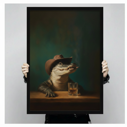 Close-up of a black framed fine art print showing a vintage-style alligator in a cowboy hat with a whiskey tumbler