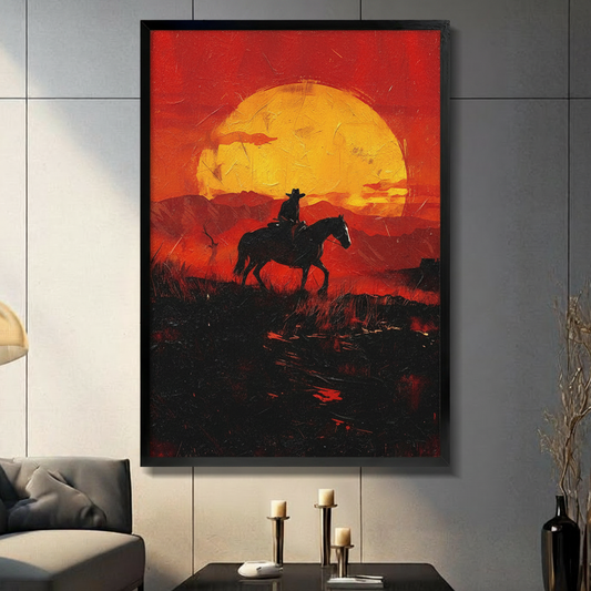 Western cowboy on horseback silhouette at sunset framed canvas wall art displayed in a moody living room with candleholders